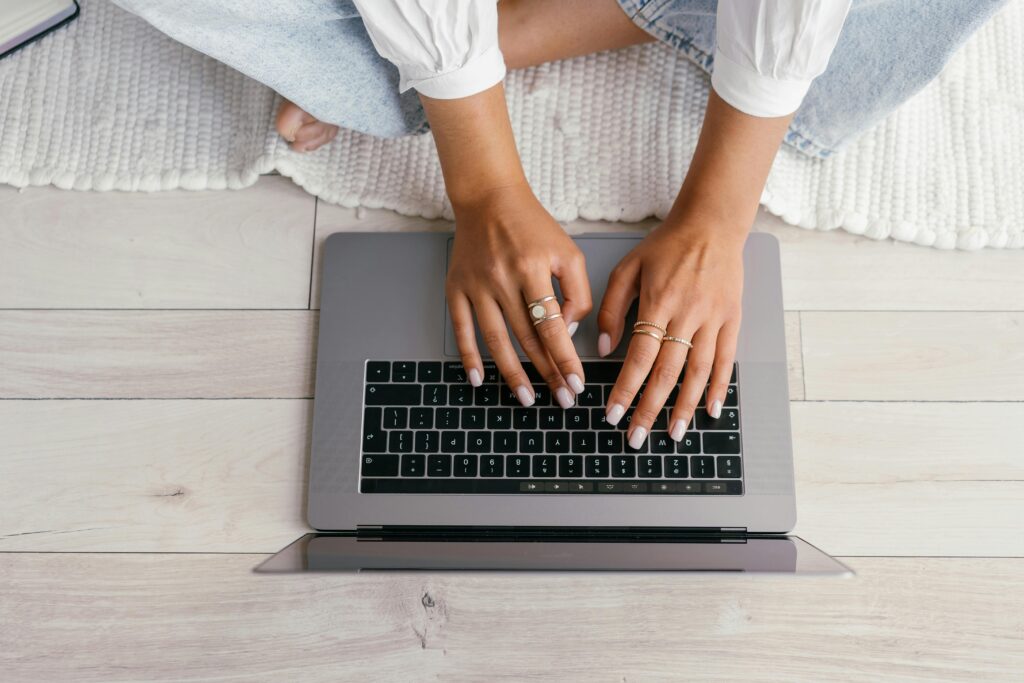 Photo by Mikhail Nilov: https://www.pexels.com/photo/crop-woman-typing-on-laptop-9159409/