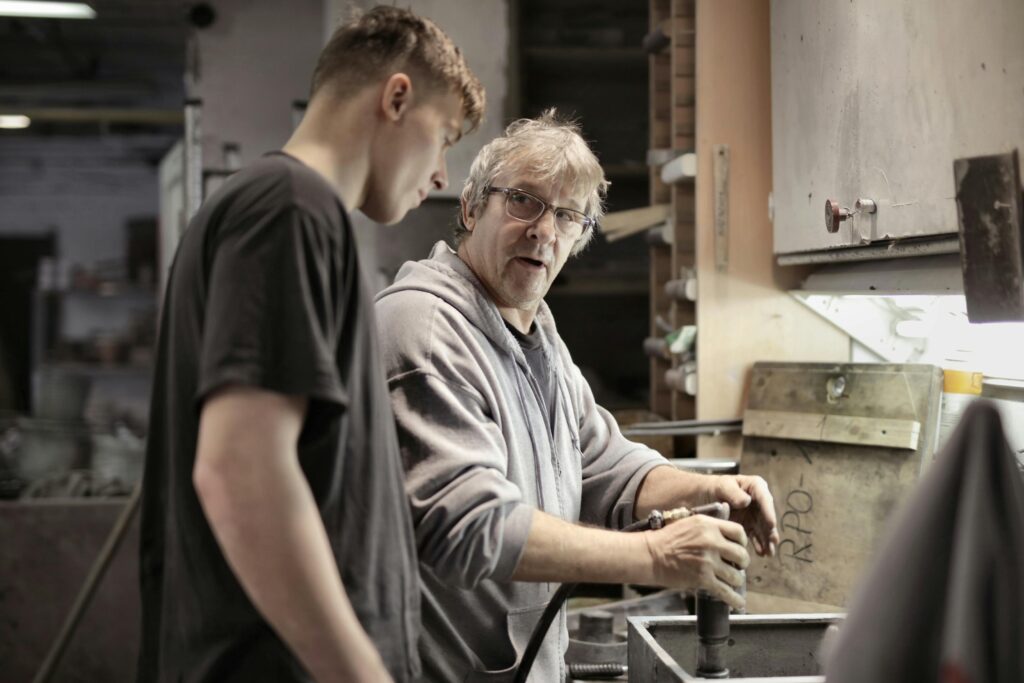 Photo by Andrea Piacquadio: https://www.pexels.com/photo/workers-handling-detail-by-pneumatic-tool-in-workshop-3846262/